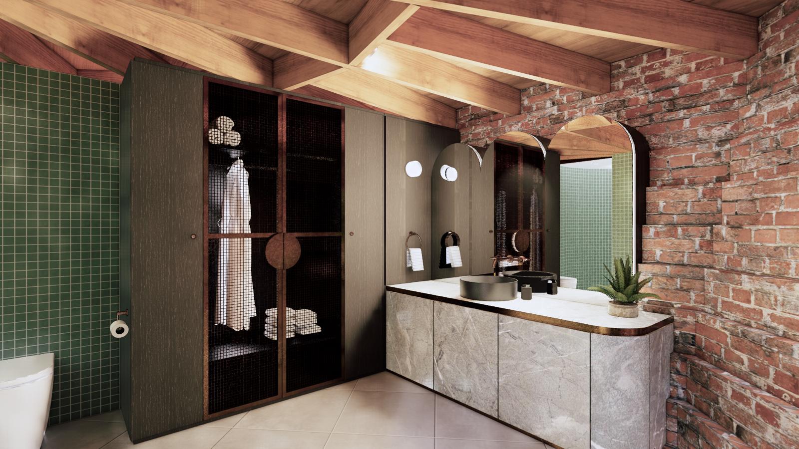 A tower suite ensuite — stone vanity against the original brick, green mosaic tile and exposed timber beams